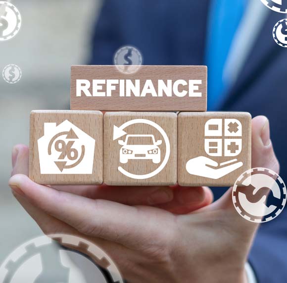 Wooden blocks with refinance text and logos on them, held out in a hand.