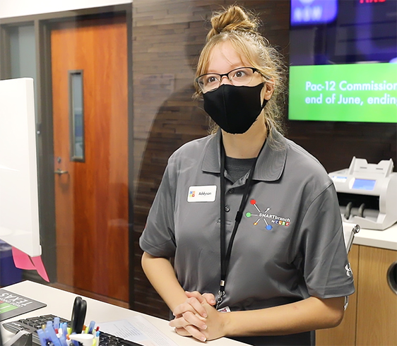 A picture of a Smart Branch teller standing behind the counter