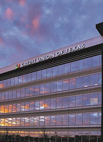 A picture of the Credit Union of Texas corporate office in Allen, Texas at sunset.