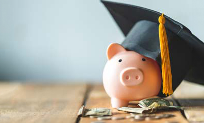 A graduation cap on a Piggy Bank