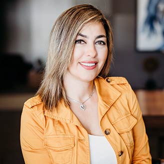 A headshot of a Credit Union of Texas Community Engagement Officer named Lin Adi.